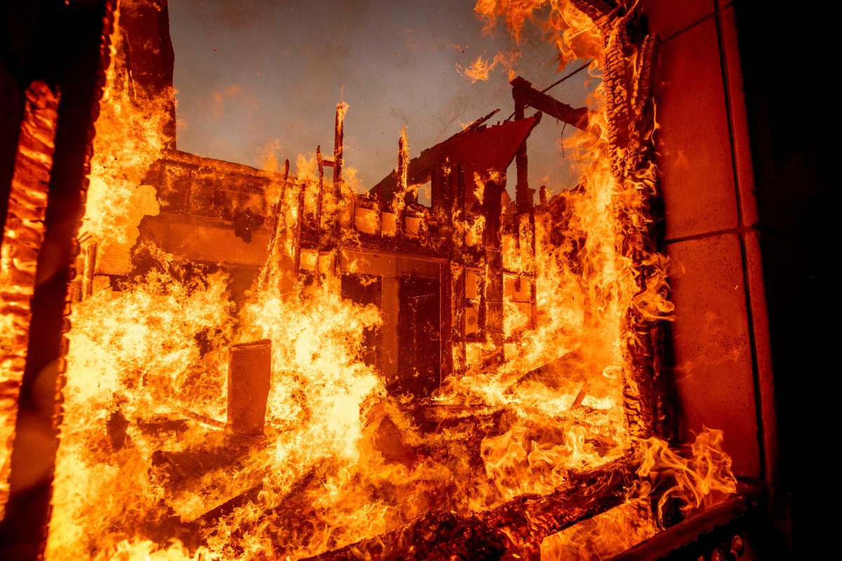 The Palisades Fire burns a residence in the Pacific Palisades neighborhood of Los Angeles, Tuesday, Jan. 7, 2025.