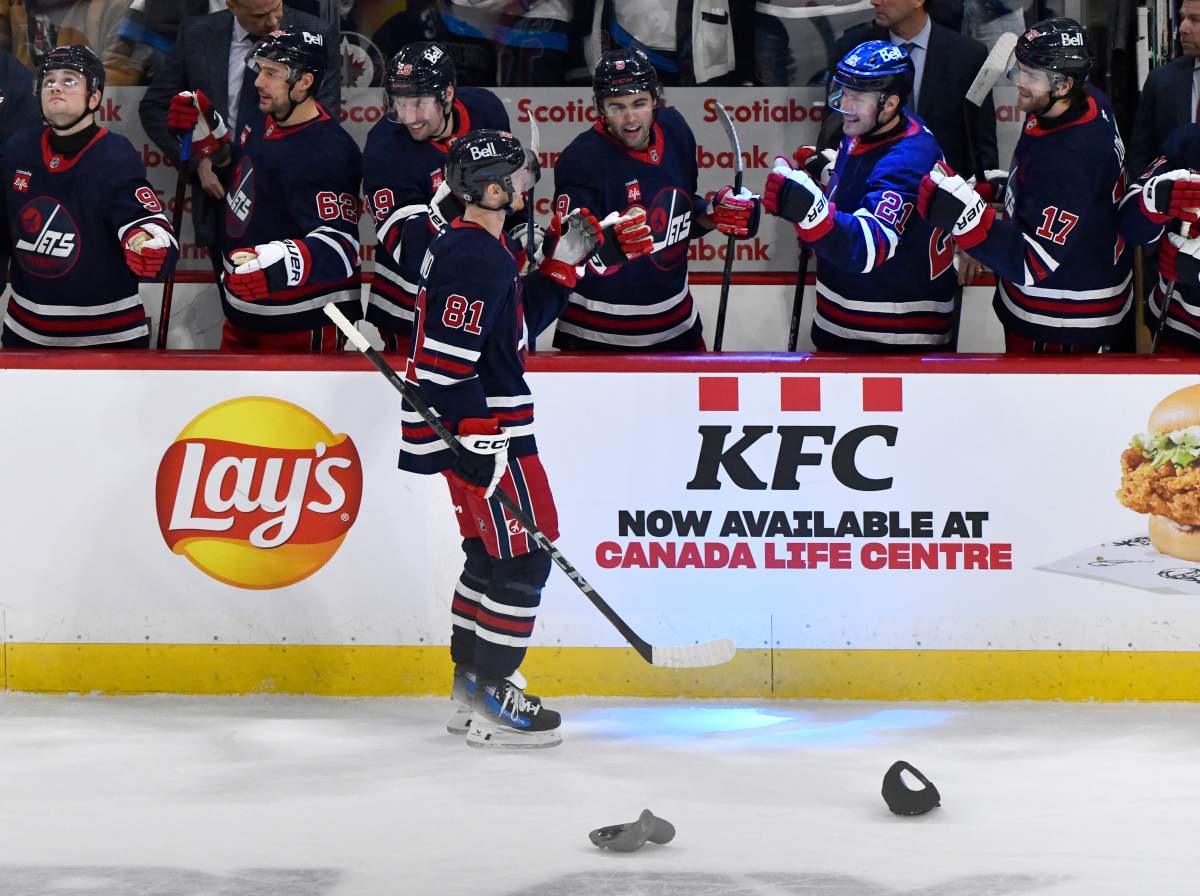 Winnipeg Jets' Kyle Connor (81) celebrates his third goal of the period against the Vancouver Canucks with teammates during the first period of their NHL hockey game in Winnipeg, Tuesday January 14, 2025. THE CANADIAN PRESS/Fred Greenslade.