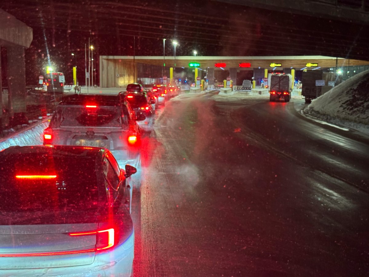 Cars are backed up at the US-Canada border in Stanstead, Quebec, after a shooting involving a U.S. Border Patrol agent in Coventry, Vt., Monday, Jan. 20, 2025. (AP Photo/Chloe Jones)