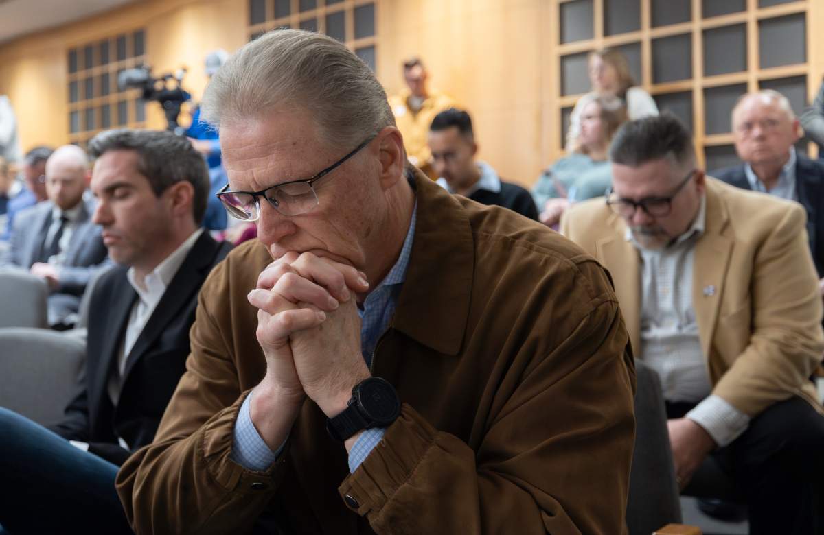 Pastor Bob Becker takes part in a prayer vigil in Wichita, Kan., on Thursday, Jan. 30, 2025, for those affected by the crash of American Airlines flight 5342 near Washington the day before. (AP Photo/Travis Heying)