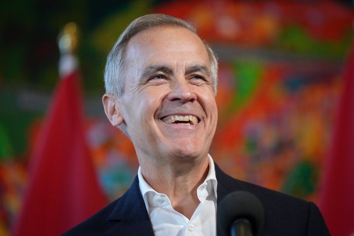 Former Bank of Canada governor Mark Carney laughs while speaking to reporters at the Liberal caucus retreat in Nanaimo, B.C., on September 10, 2024.