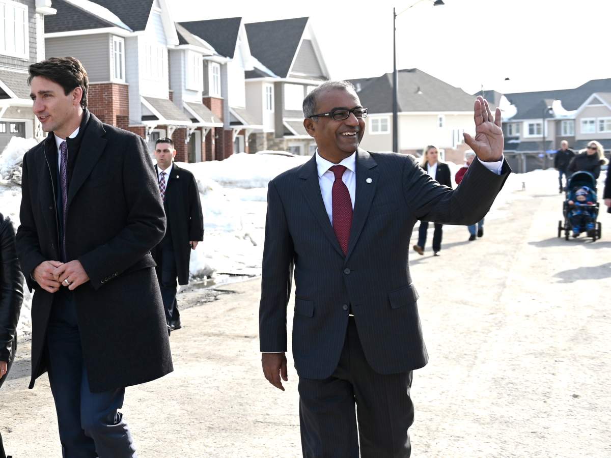 Liberal MP Chandra Arya walks with Prime Minister Justin Trudeau