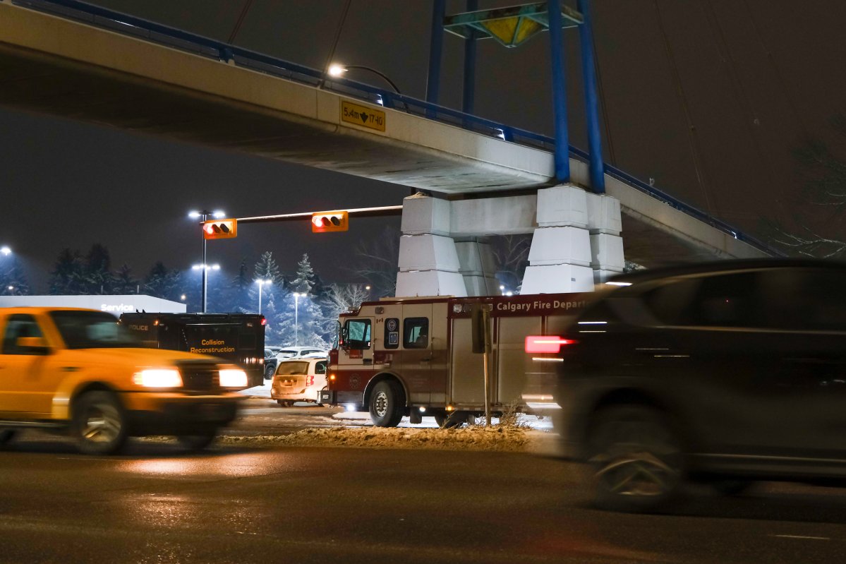 Vehicles pass by the scene of fatal crash on Crowchild Trail