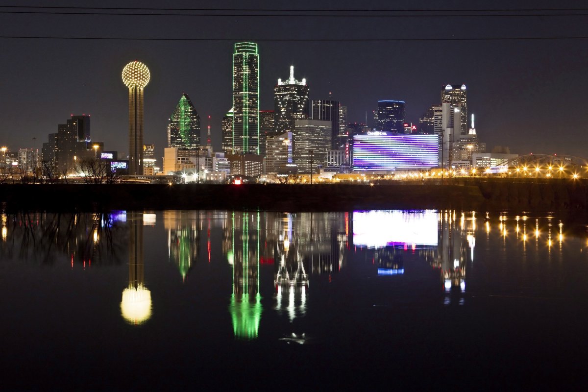 FILE - In this Jan. 26, 2012 file photo, the Dallas skyline is reflected in the Trinity River in Dallas.