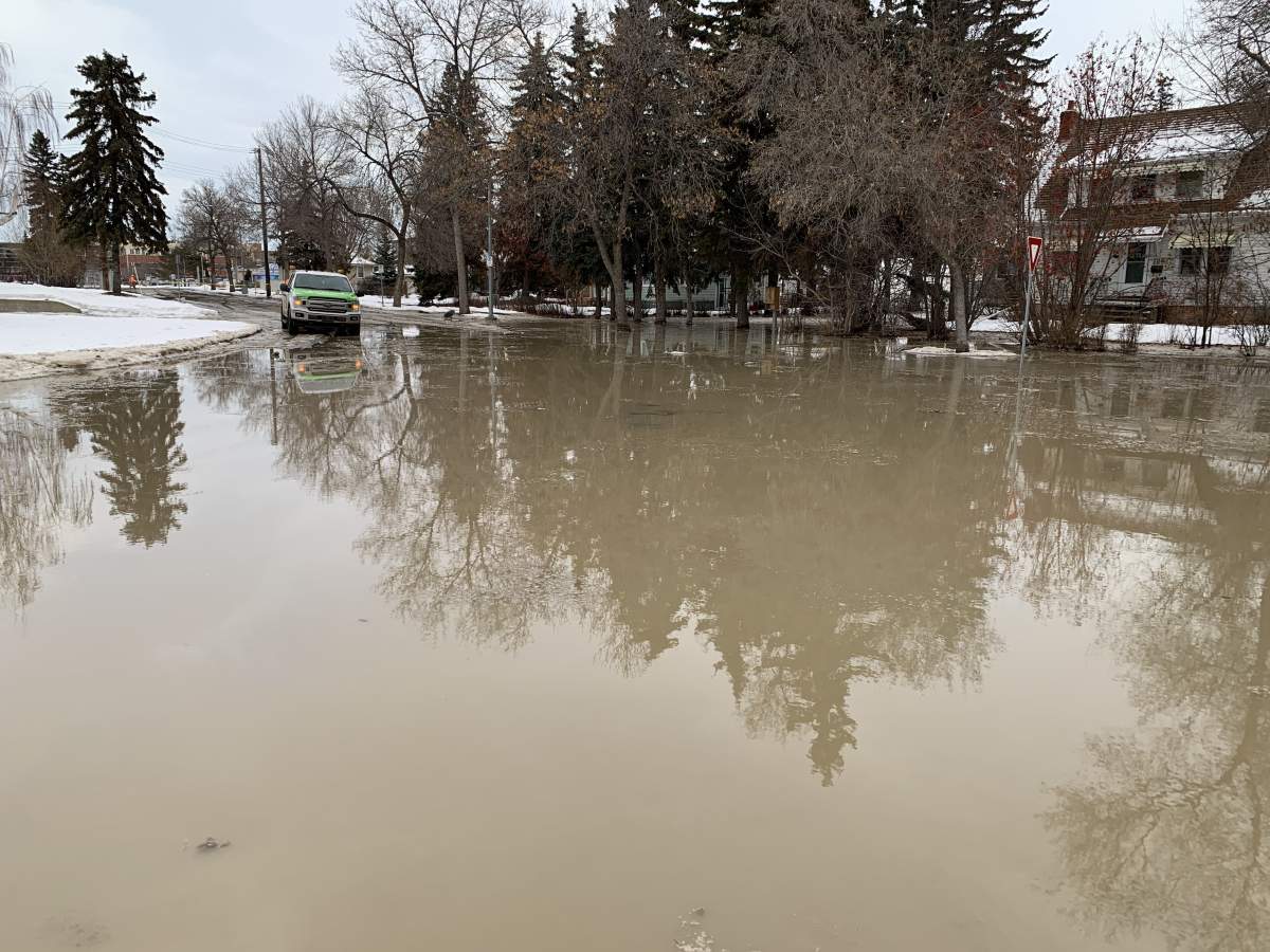 A flooded street in Edmonton is seen on Jan. 14, 2025 in the area of 110 Street by Queen Mary Park.