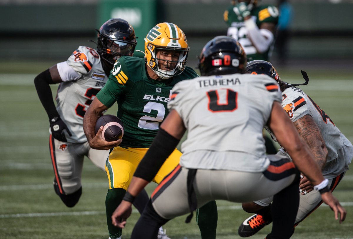 Edmonton Elks' quarterback Tre Ford (2) runs the ball against the B.C. Lions during first half CFL action in Edmonton, Sunday, Aug. 11, 2024.