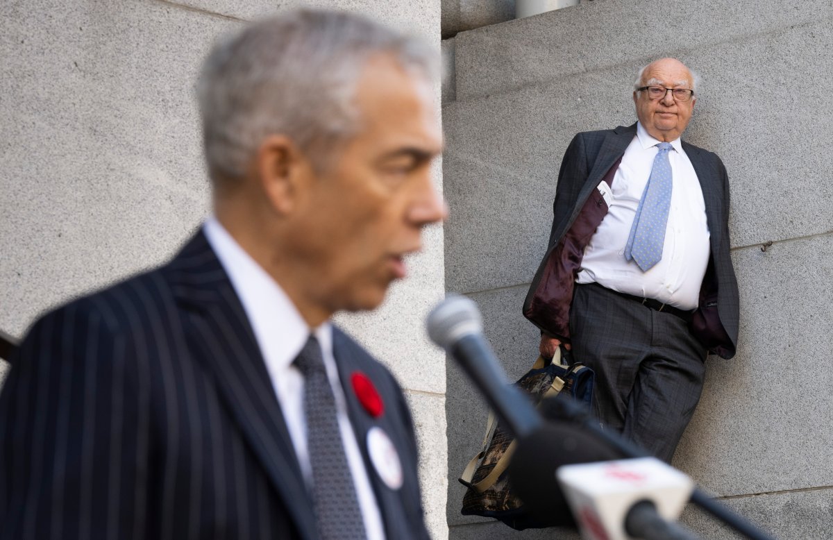 Lawyer Julius Grey stands listens to Frank Baylis outside the Court of Appeal on the first day of hearings on the appeal of Bill 21 in Montreal, on Monday, November 7, 2022. THE CANADIAN PRESS/Paul Chiasson