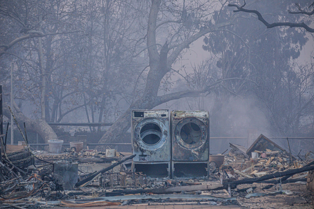 The remnants of a washer and dryer during the Eaton Fire in Altadena, Calif., on Wed., Jan. 8, 2025.