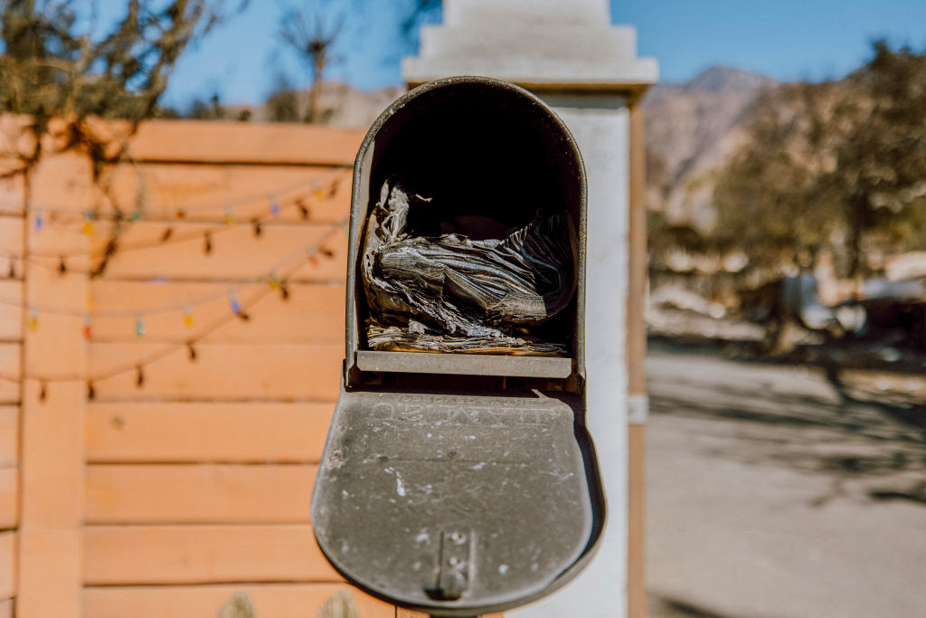 A burned mailbox on January 10, 2025, after the Eaton Fire that started on January 7 in Altadena, Calif..