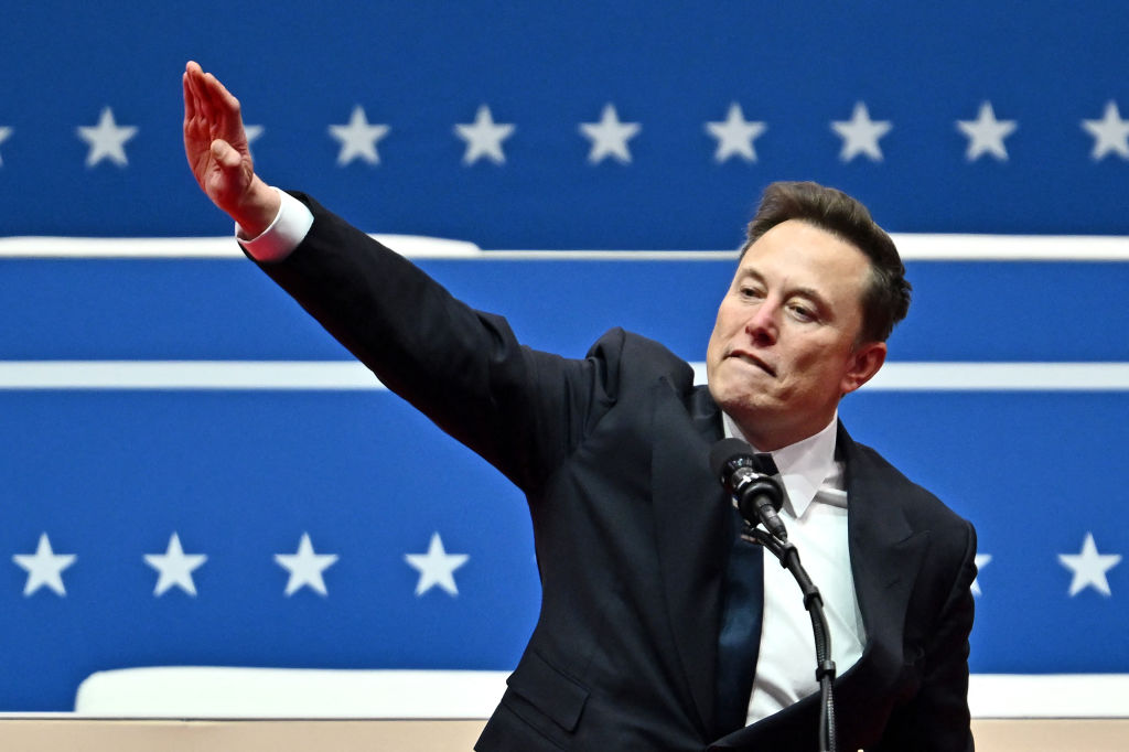 Tesla and SpaceX CEO Elon Musk gestures as he speaks during the inaugural parade inside Capital One Arena, in Washington, DC, on January 20, 2025.