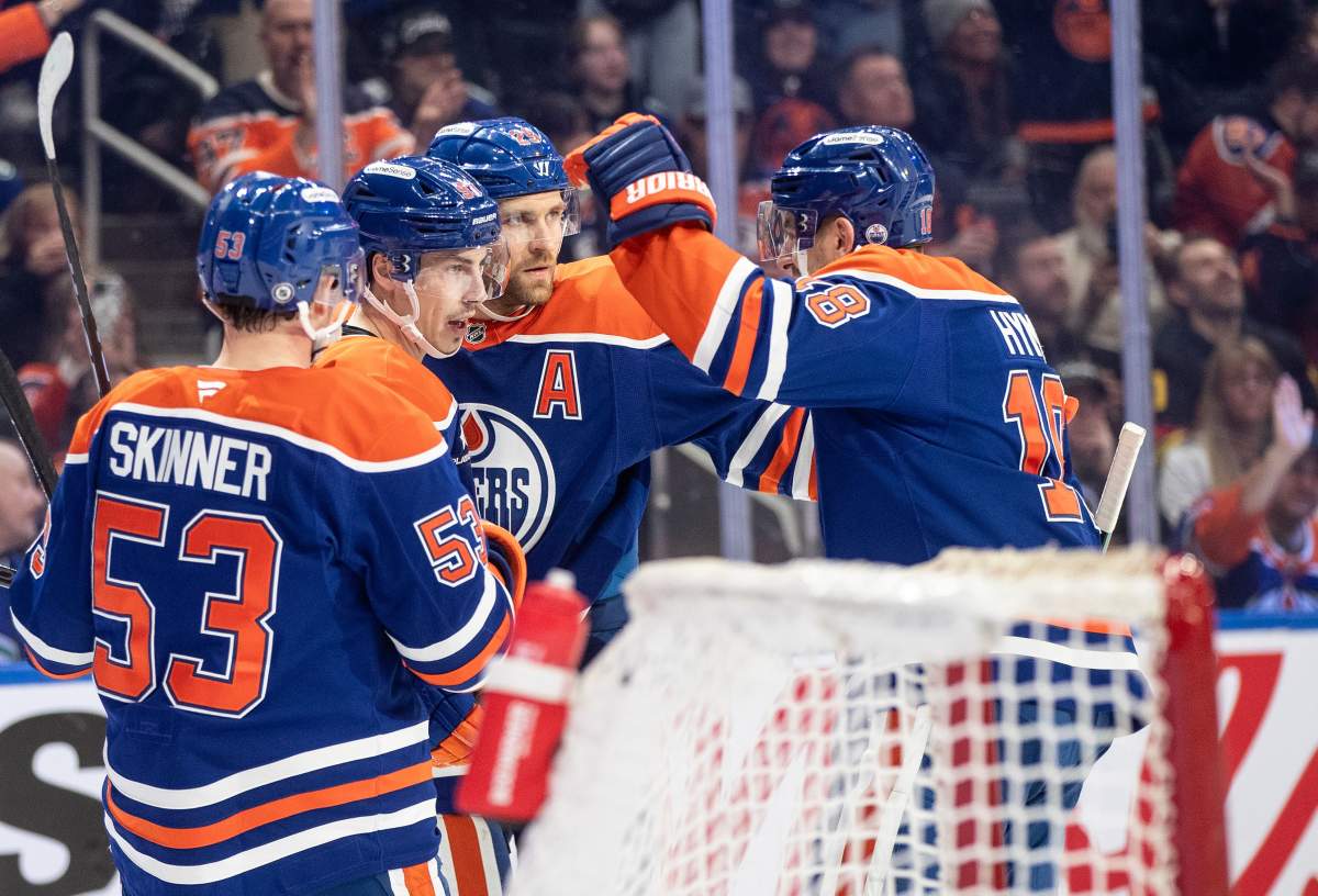 Edmonton Oilers' Jeff Skinner (53), Ryan Nugent-Hopkins (93), Leon Draisaitl (29) and Zach Hyman (18) celebrate a goal against the Vancouver Canucks during second period NHL action in Edmonton on Thursday, January 23, 2025.