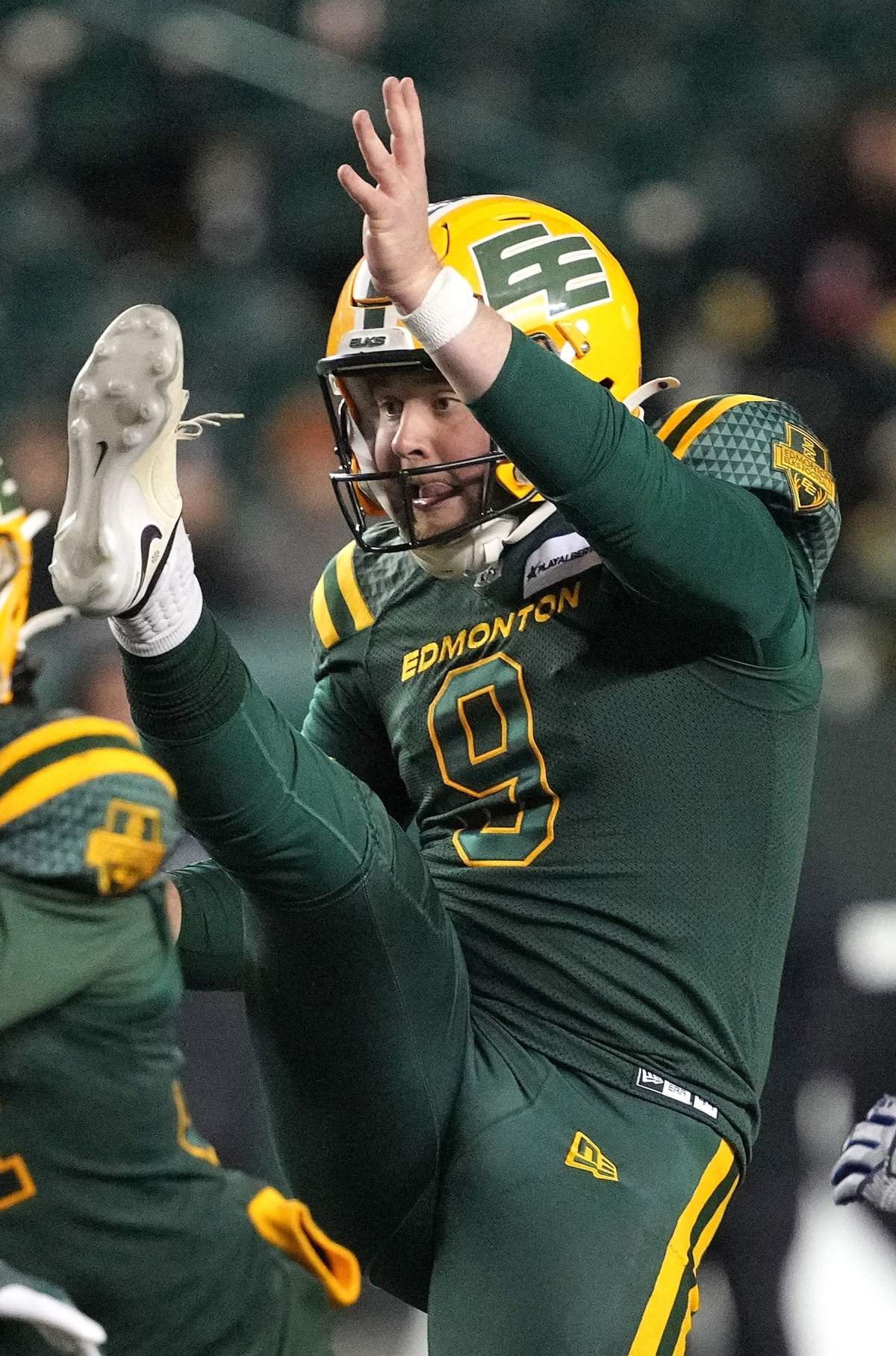 Edmonton Elks' Jake Julien kicks the ball to score a rouge in overtime to defeat the Toronto Argonauts during CFL football action in Edmonton, on Friday, October 25, 2024.