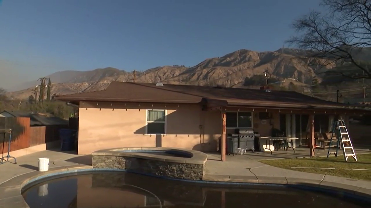 Armed with garden hose, L.A. resident saves home from wildfire