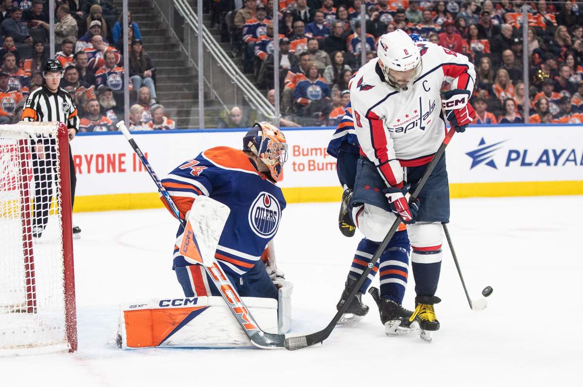 Washington Capitals' Alex Ovechkin (8) looks for the rebound off of Edmonton Oilers goalie Stuart Skinner (74) during third period NHL action in Edmonton on Wednesday March 13, 2024.