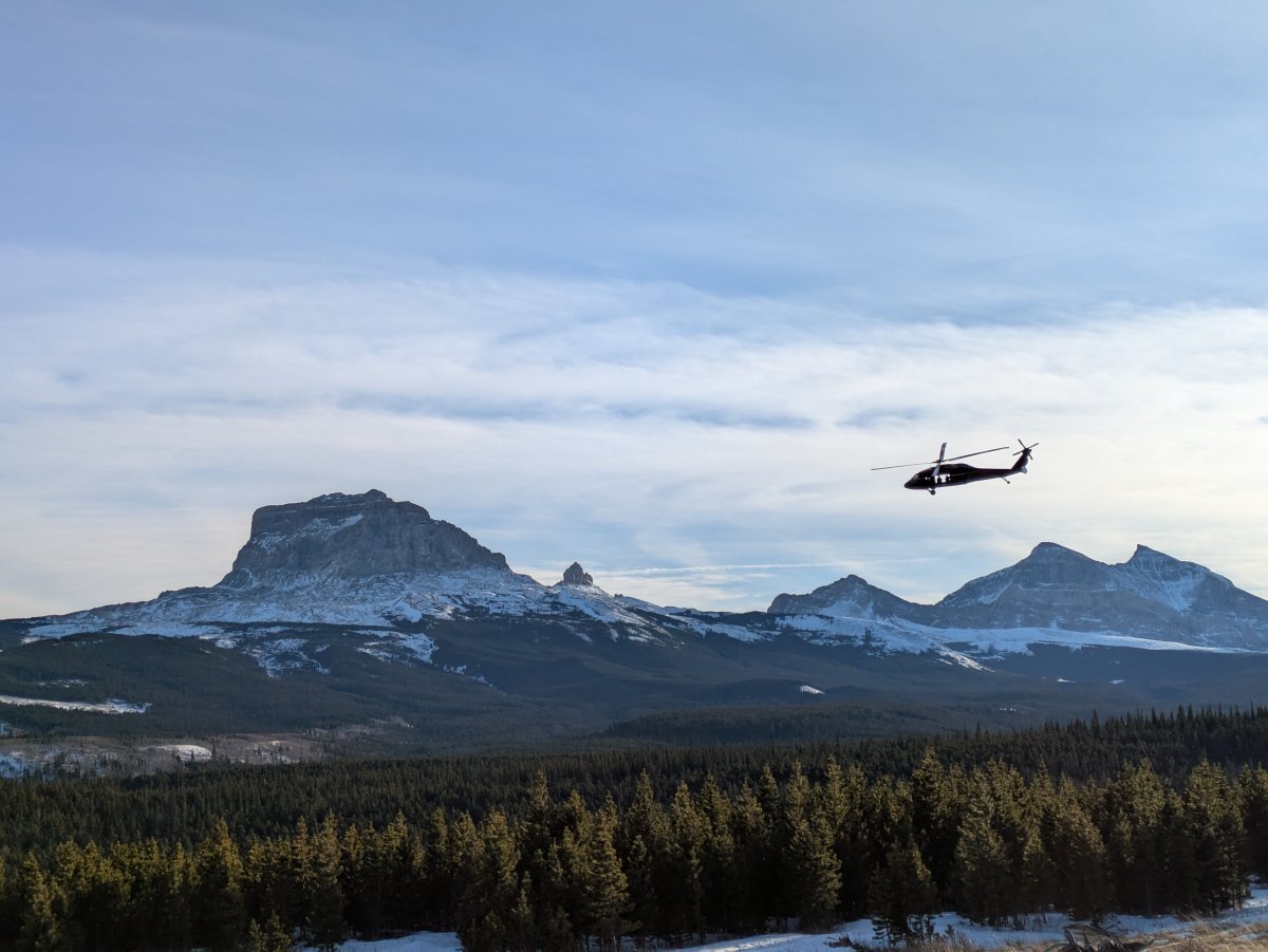 A RCMP Black Hawk helicopter near the Rocky Mountains in southern Alberta on Tuesday, January 28, 2025.