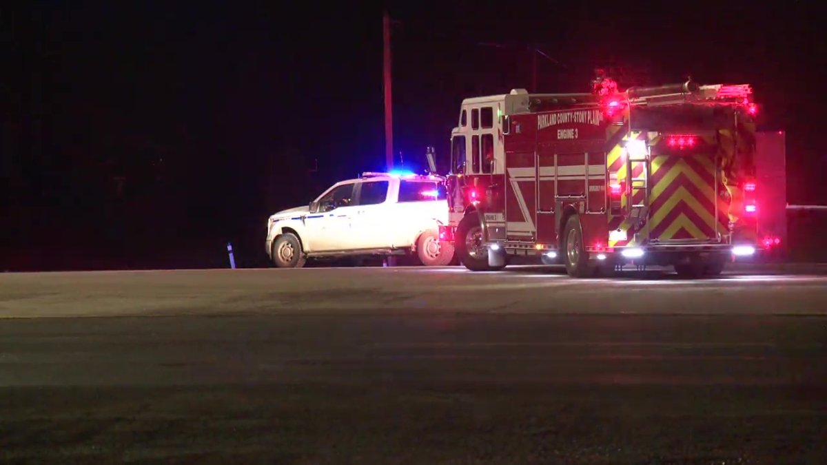 RCMP and firefighters in Parkland County responding to a body on Highway 16 near Stony Plain on Sunday, Jan. 26, 2025.