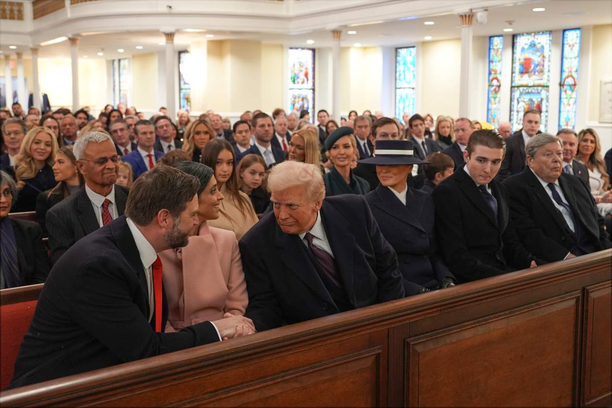 President-elect Donald Trump shakes hands with Vice President-elect JD Vance as Usha Vance, Melania Trump, Barron Trump and Victor Knavs watch before a service at St. John's Church, Monday, Jan. 20, 2025, in Washington, ahead of the 60th Presidential Inauguration.