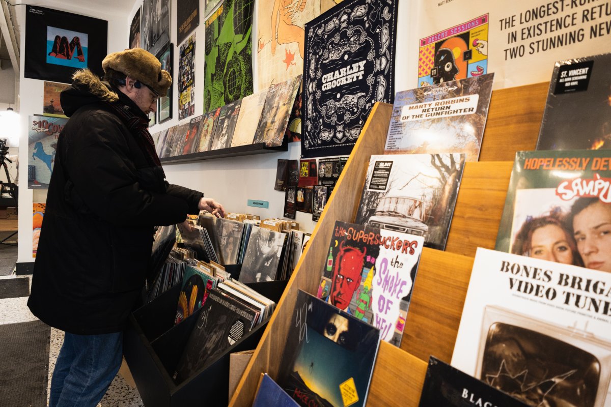 A customer browses the shelves of X-Ray Records