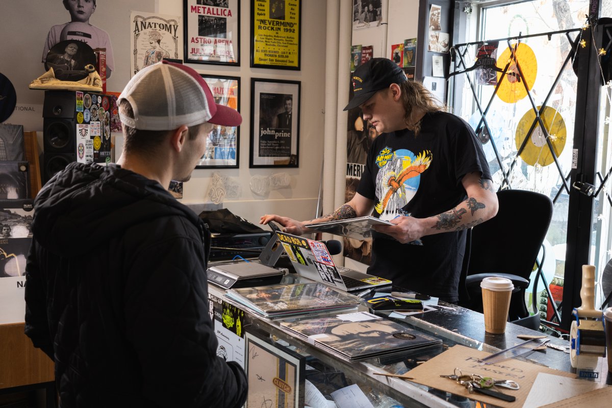 Noah Biegler (right) plans to run the online side of the store after the physical shop closes.