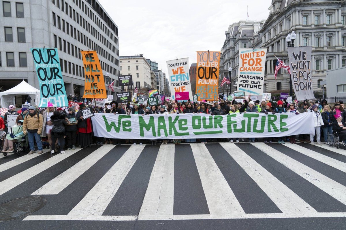 Demonstrators walk on the street as they participate in the People's March, Saturday, Jan. 18, 2025, in Washington. (AP Photo/Jose Luis Magana) Jose Luis Magana