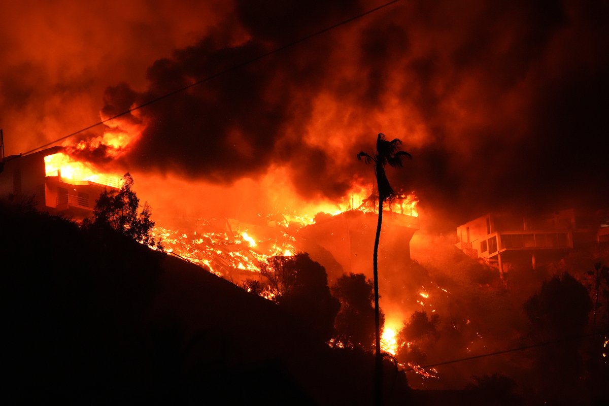 The Palisades Fire burns homes on a hilltop in the Pacific Palisades neighbourhood of Los Angeles, Wednesday, Jan. 8, 2025.