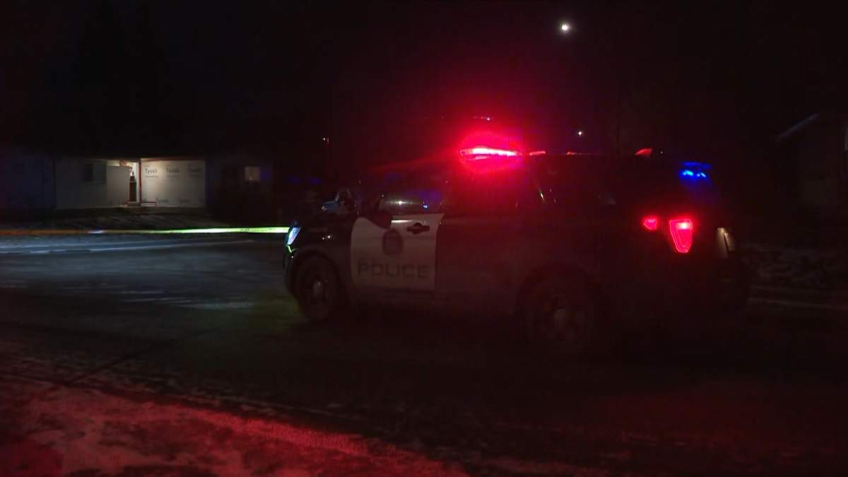A police cruiser and crime scene tape are seen outside a house in Highland Park where officers were called out to reports of a shooting early Wednesday morning.