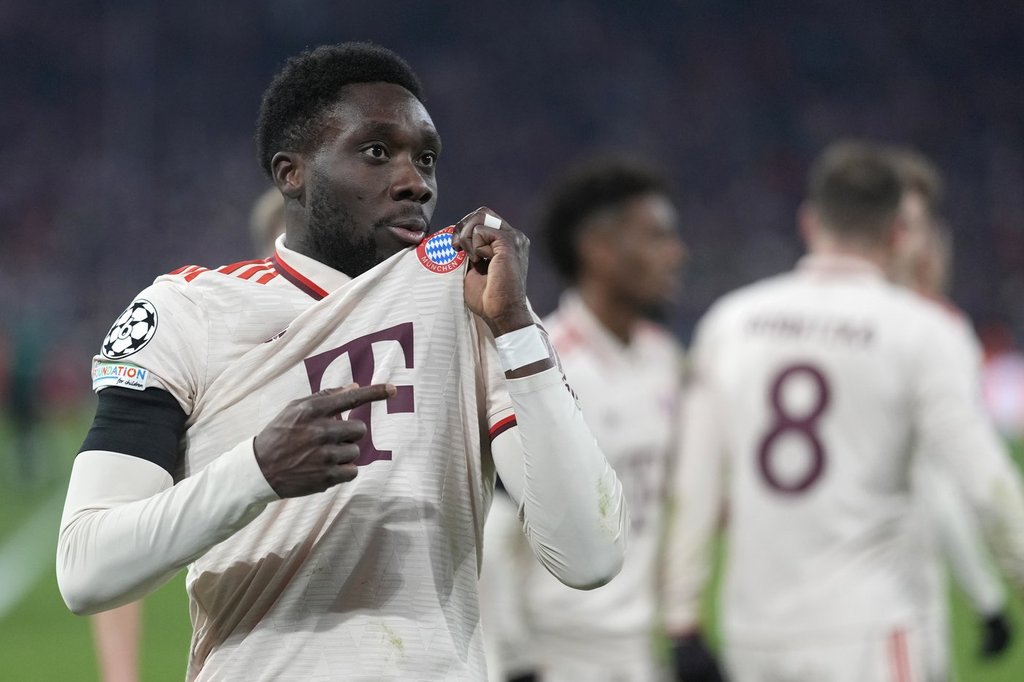 Bayern's Alphonso Davies celebrates after scoring his side's opening goal during the Champions League playoff second leg soccer match between FC Bayern Munich and Celtic Glasgow at the Allianz Arena in Munich, Germany, Tuesday, Feb. 18, 2025.