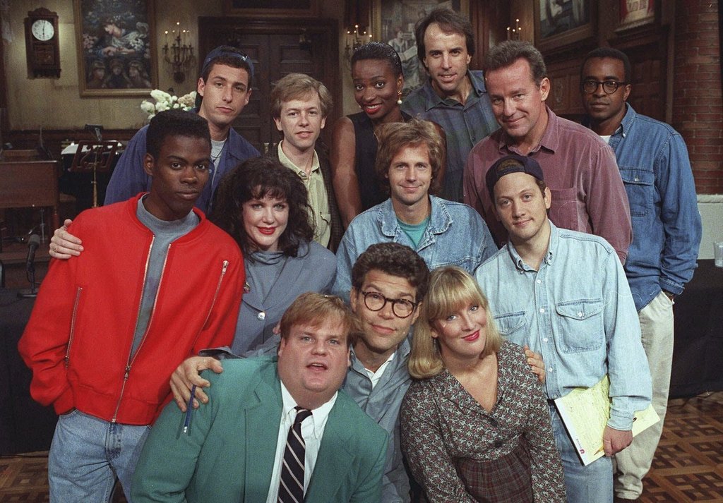 The cast of NBC's "Saturday Night Live" pose on the show's set in New York, Sept. 22, 1992. From left, front row; Chris Farley, Al Franken and Melanie Hutsell. In middle row, from left: Chris Rock, Julia Sweeney, Dana Carvey and Rob Schneider. In back row, from left: Adam Sandler, David Spade, Ellen Cleghorne, Kevin Nealon, Phil Hartman and Tim Meadows.