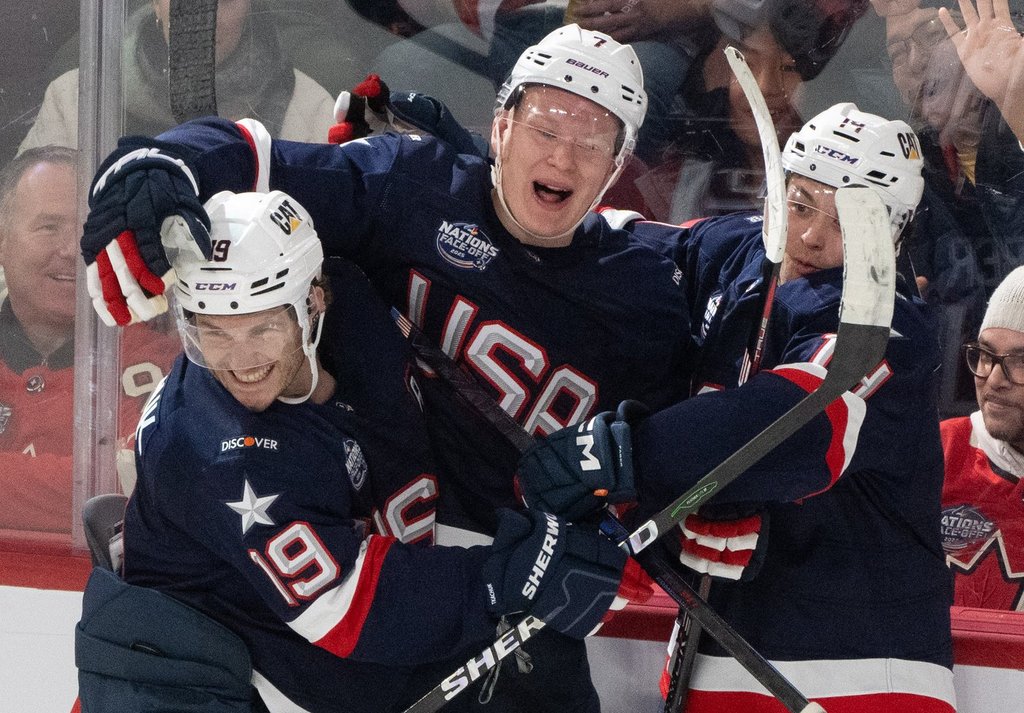 United States' Brady Tkachuk (7) celebrates his goal with teammates Matthew Tkachuk (19) and Brock Faber (14) during the American's 6-1 win over Finland in their opening game of the 4 Nations Cup.