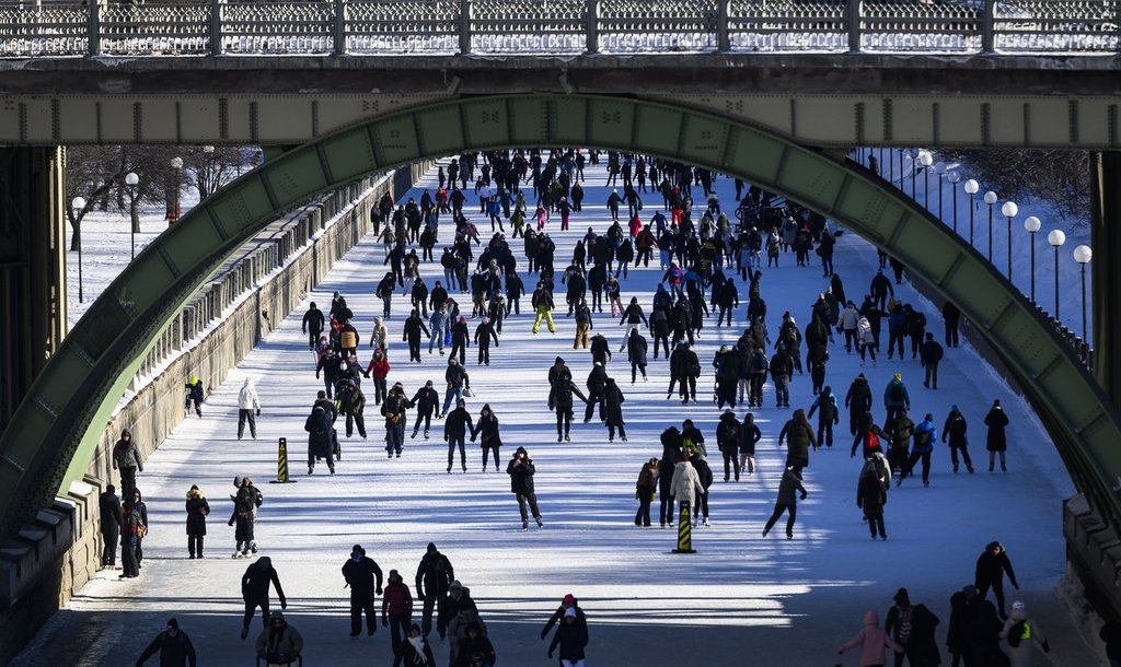 People skate on the Rideau Canal on the first weekend of the Winterlude festival in Ottawa, on Saturday, Feb. 1, 2025. The Rideau Canal is a UNESCO World Heritage Site.