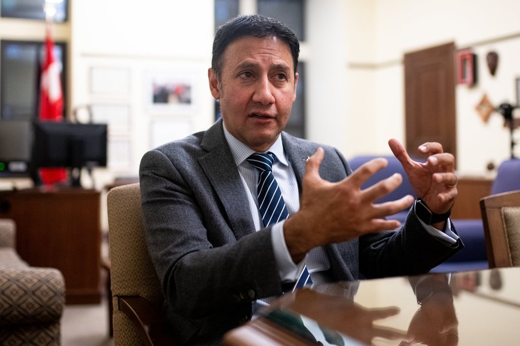 Minister of Justice Attorney General of Canada Arif Virani speaks to a reporter at his office in Ottawa on Wednesday, Dec. 11, 2024.