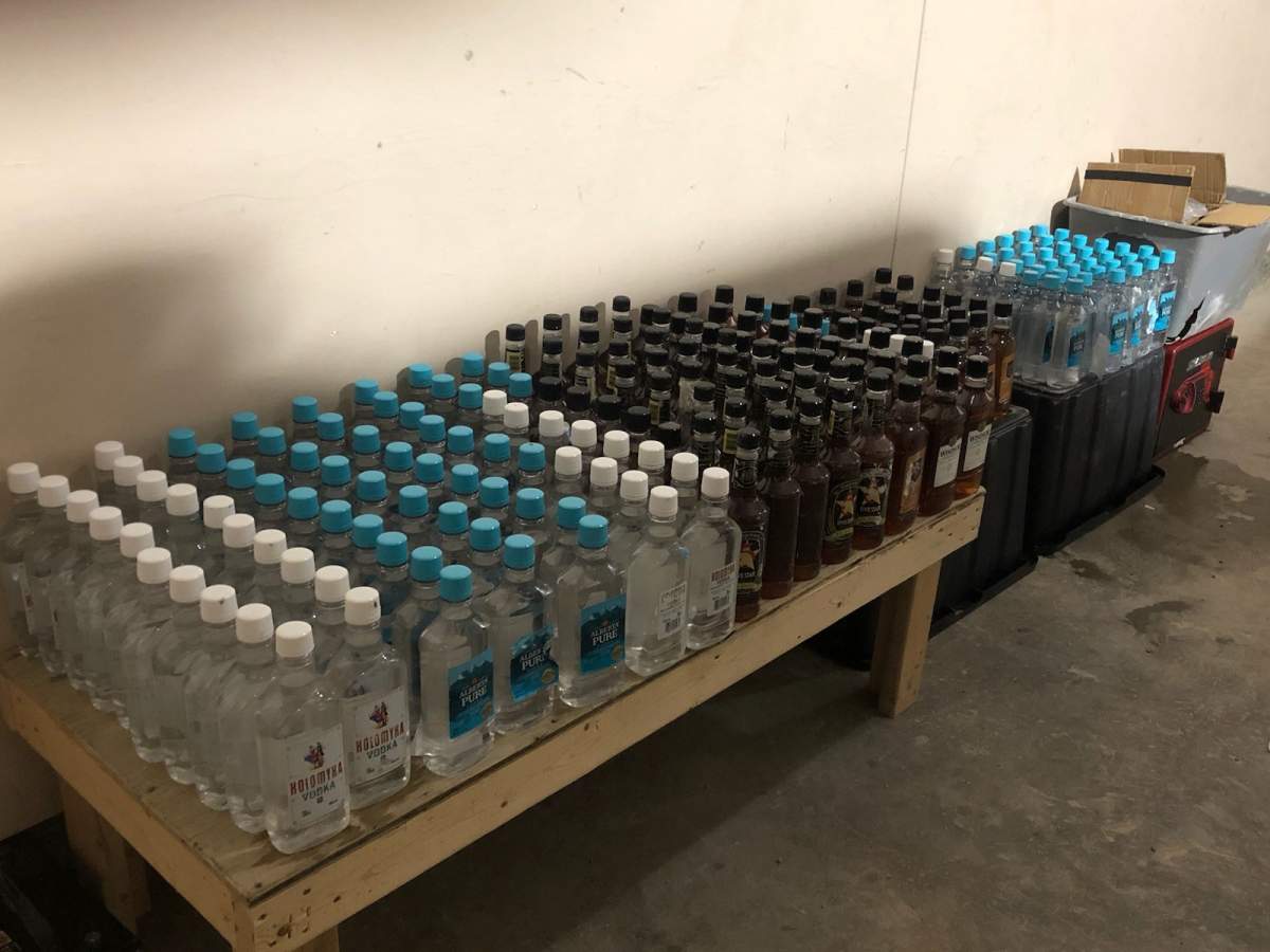 Manitoba RCMP say they seized hundreds of bottles of liquor in the search of a home.