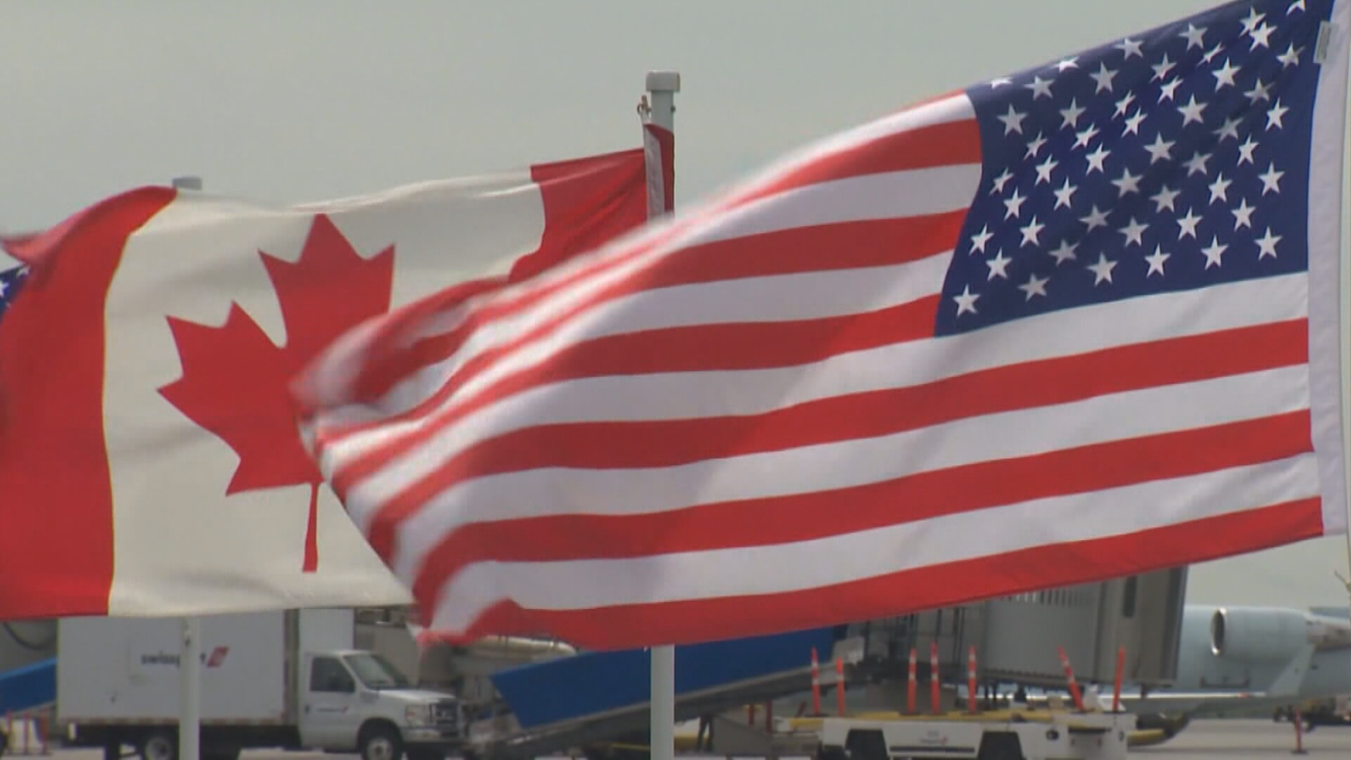 An American and Canadian flag.