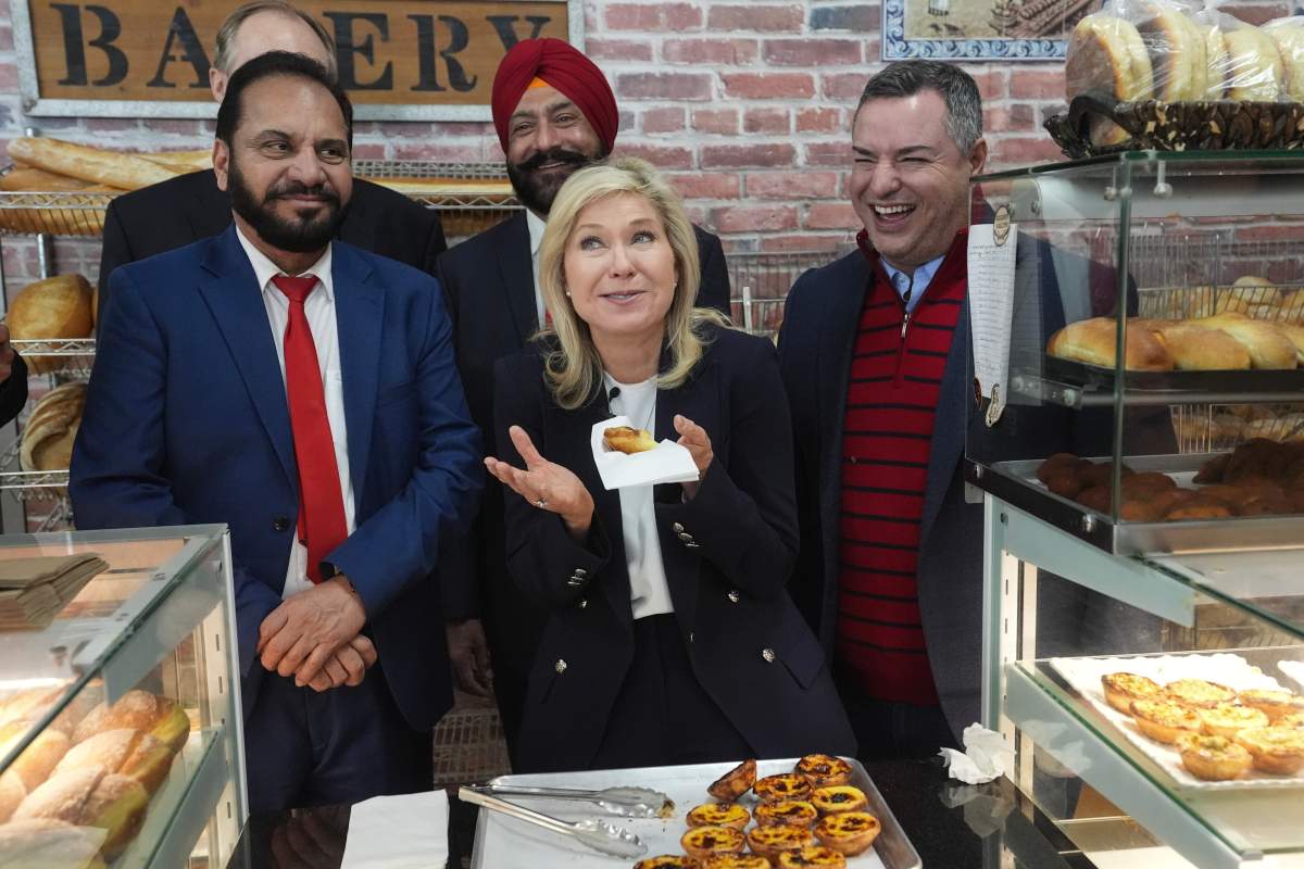 Ontario Liberal Leader Bonnie Crombie stands with local candidates as she visits Golden Grain Bakery during a campaign stop in Brampton, Ont., Tuesday, Feb. 4, 2025.