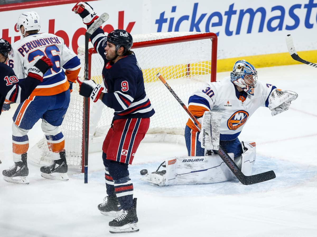 Winnipeg Jets' Alex Iafallo (9) celebrates his goal on New York Islanders goaltender Ilya Sorokin (30) during first period NHL action in Winnipeg on Friday, February 7, 2025. THE CANADIAN PRESS/John Woods.