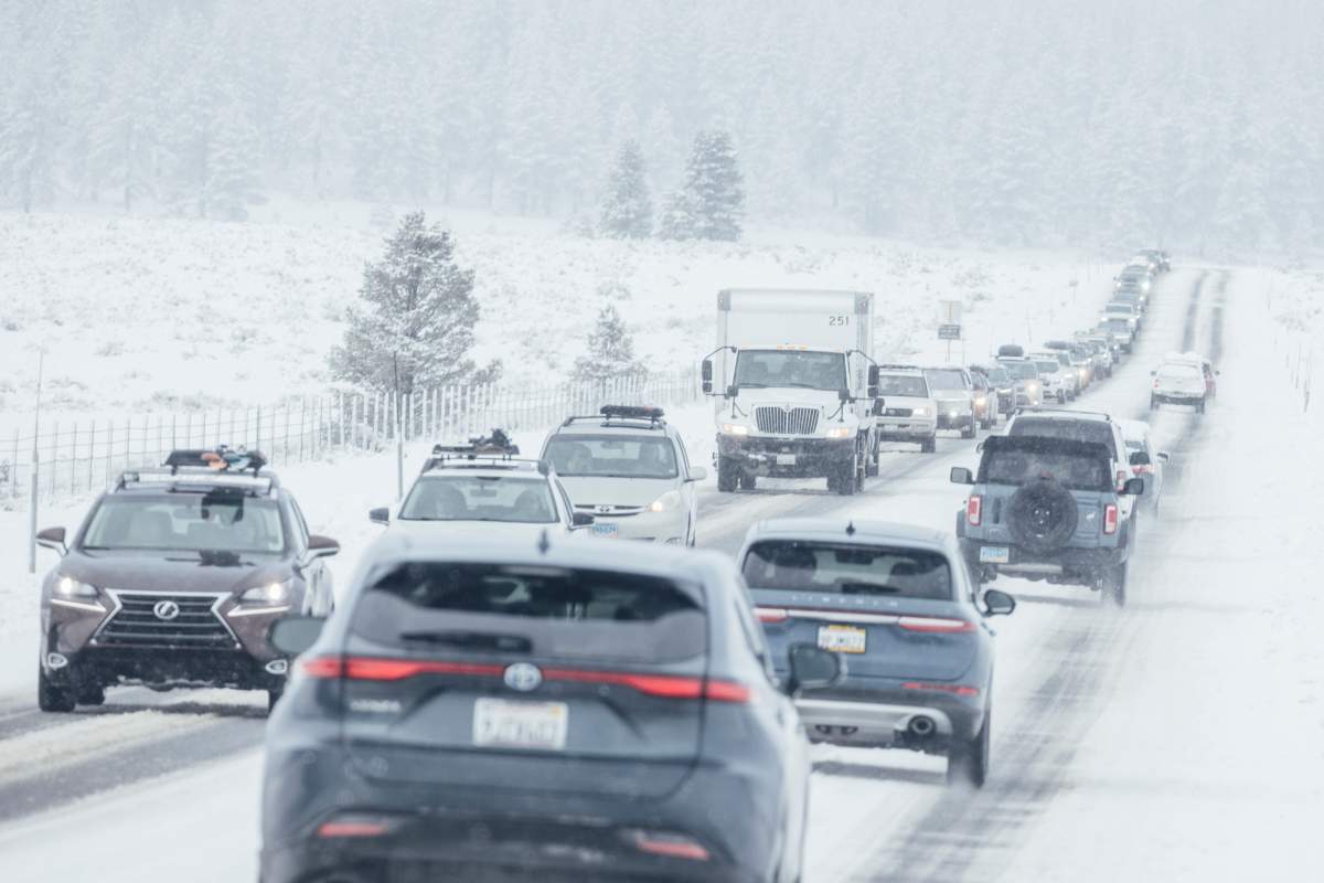 Motorists travel along a snow covered State Route 267 in Truckee, Calif., Friday, Feb. 14, 2025.