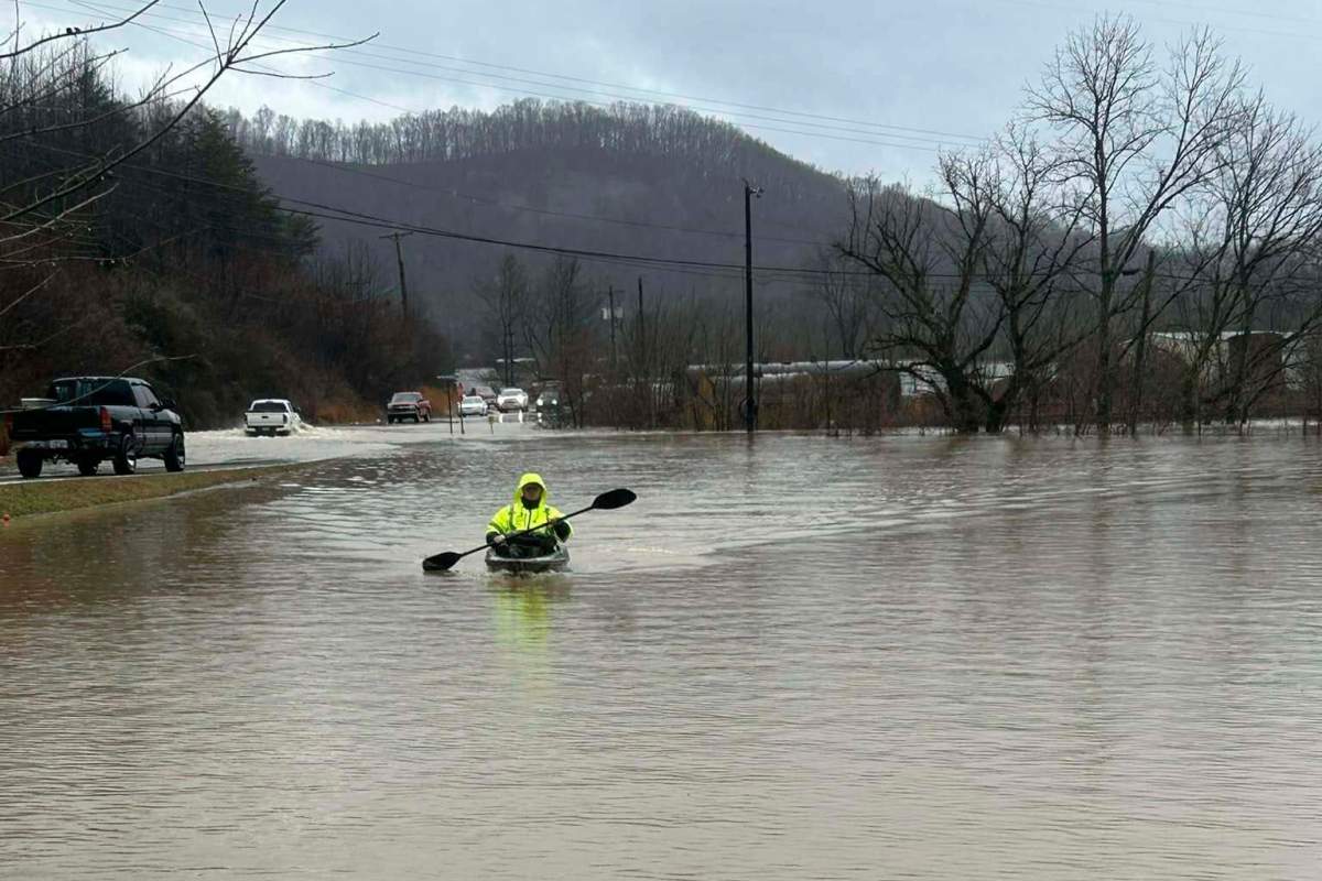 In this photo provided by Donnie Smith, a kayaker navigates floodwaters Saturday, Feb. 15, 2025, in rural Knox County, Ky.