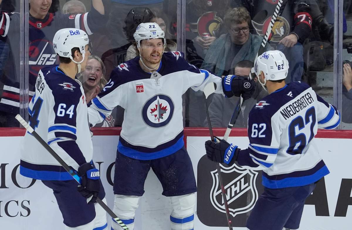 Winnipeg Jets centre Mason Appleton (centre) celebrates his goal against the Ottawa Senators with defenceman Logan Stanley (left) and right wing Nino Niederreiter (right) during first period NHL action, Wednesday, Feb. 26, 2025 in Ottawa.  THE CANADIAN PRESS/Adrian Wyld.