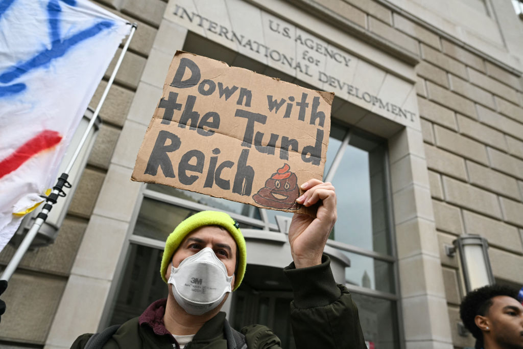 People protest outside of the headquarters for United States Agency for International Development (USAID), before Congressional Democrats hold a news conference in Washington, D.C., on Feb. 3, 2025.