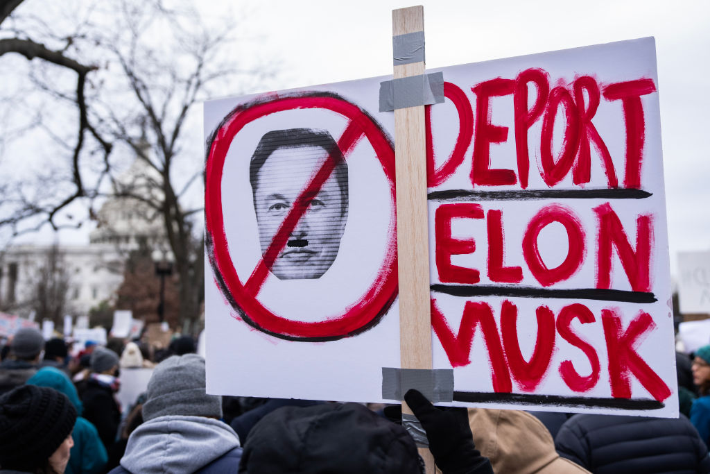 A sign depicting Elon Musk is seen at a rally in Upper Senate Park in response to the disruption of USAID to demand that congress and President Trump act to restore foreign aid, on Wednesday, Feb. 5, 2025.