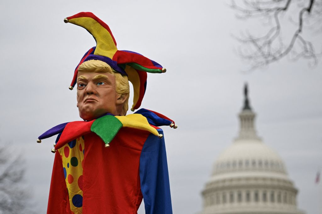 An effigy of President Donald Trump dressed as a jester is seen as people protest against the administration's decision to virtually shut down the United States Agency for International Development (USAID) at the U.S. Capitol in Washington, DC, on Feb. 5, 2025.