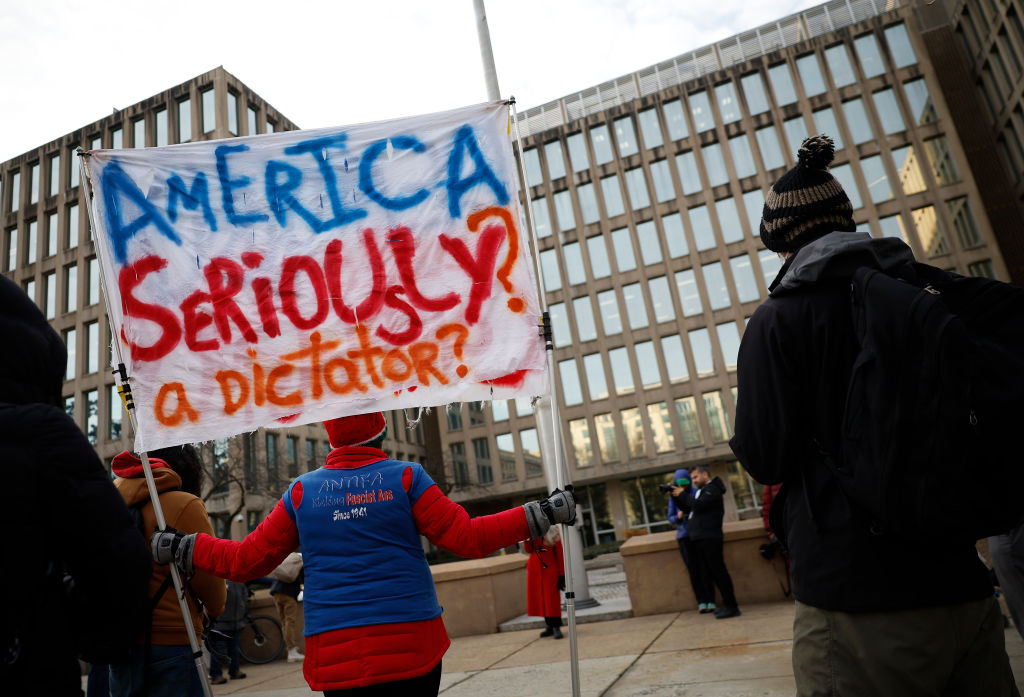 Protesters gather outside of the Theodore Roosevelt Federal Building headquarters of the U.S. Office of Personnel Management on Feb. 3, 2025 in Washington, D.C.