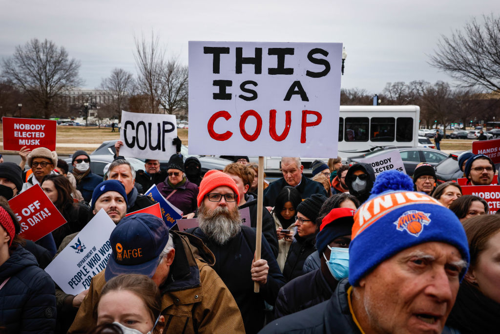 Protesters rally against the Department of Government Efficiency (DOGE) outside the U.S. Department of Labor (DOL) on Feb. 5, 2025 in Washington, DC. Workers and supporters protested ahead of a scheduled meeting between members of Elon Musk's DOGE staff and DOL management.