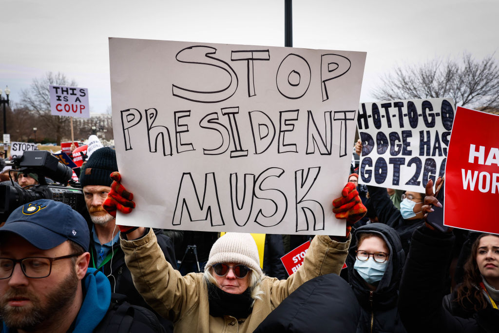 Protesters rally against the Department of Government Efficiency (DOGE) outside the U.S. Department of Labor.