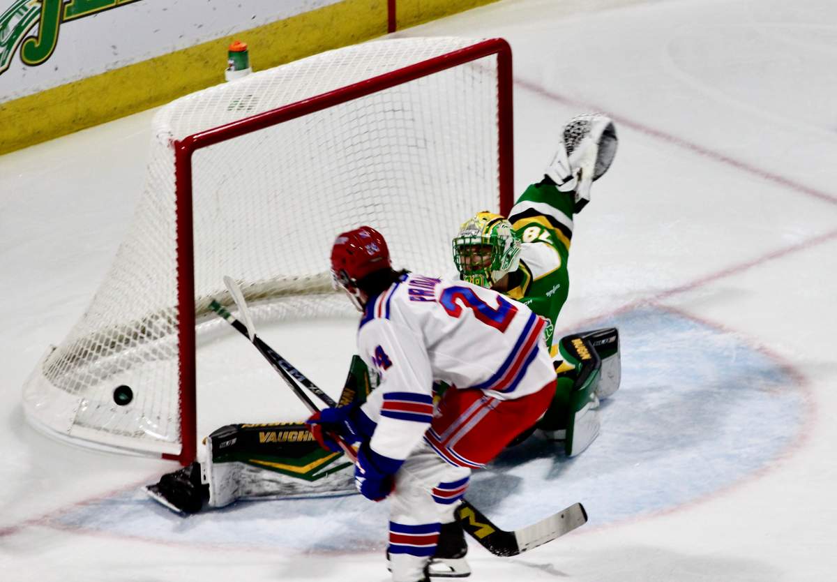 Aleksei Medvedev makes a breakaway save on Jack Pridham of the Kitchener Rangers in a game played on Feb. 4, 2025 at Canada Life Place.
