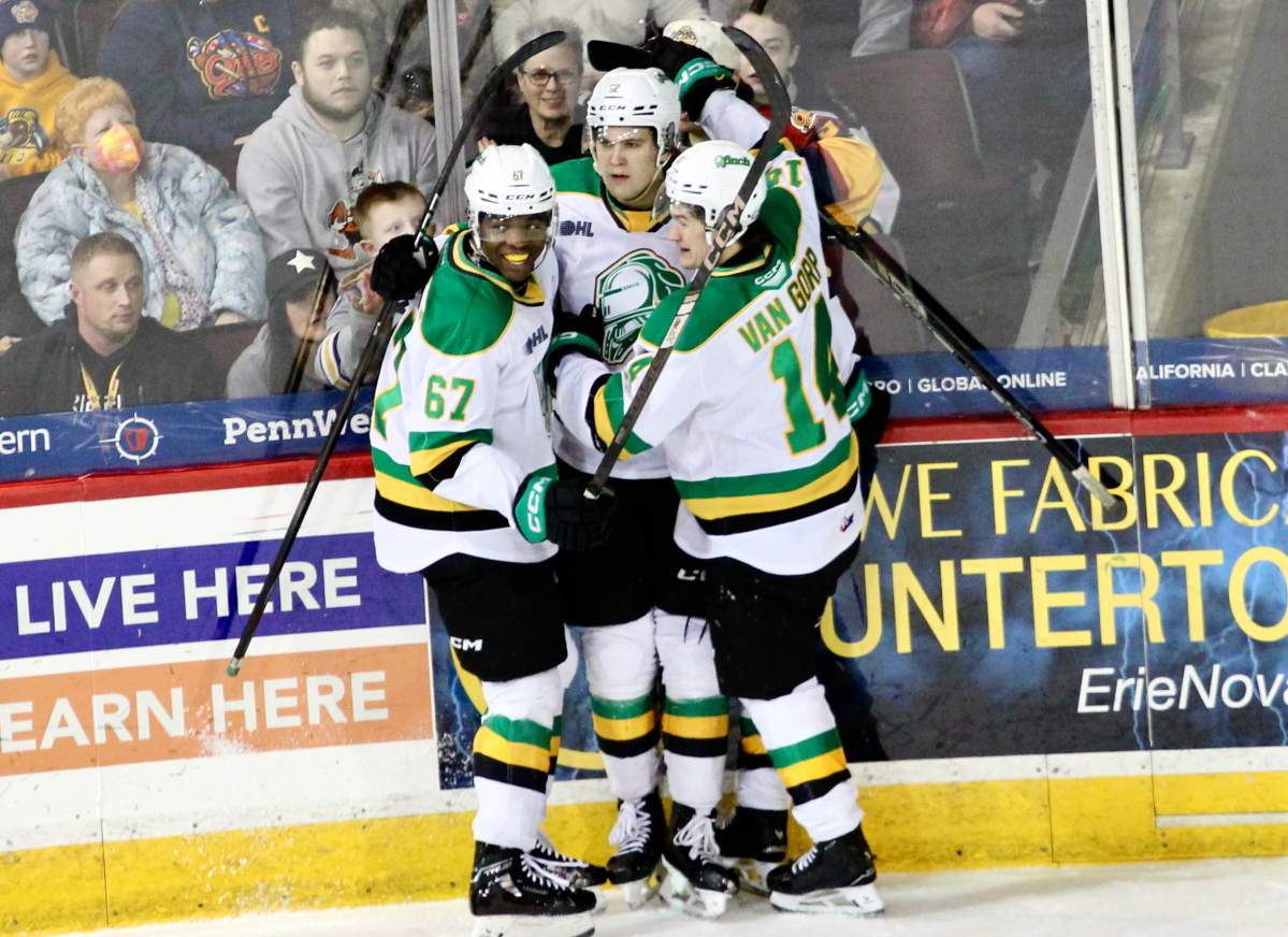 P.J. Fagan (67) and Evan Van Gorp (14) celebrate Kasper Halttunen's second period goal in a 5-1 London Knights win over the Erie Otters on Feb. 22, 2025.