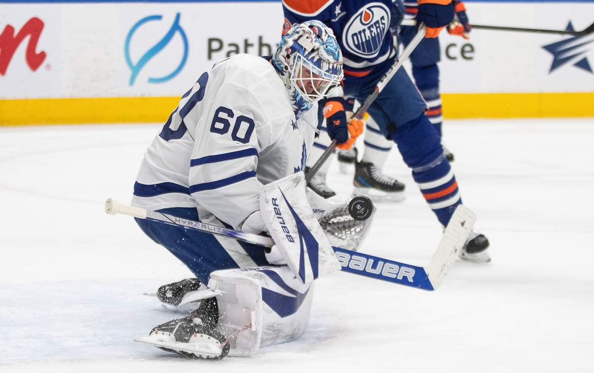 Toronto Maple Leafs goalie Joseph Woll (60) makes a save against the Edmonton Oilers during second period NHL action in Edmonton, Saturday, Feb. 1, 2025.