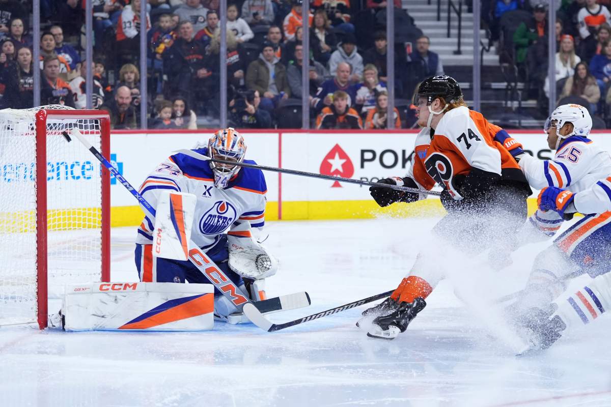 Philadelphia Flyers' Owen Tippett (74) scores a goal against Edmonton Oilers' Stuart Skinner (74) and Darnell Nurse (25) during the second period of an NHL hockey game, Saturday, Feb. 22, 2025, in Philadelphia.