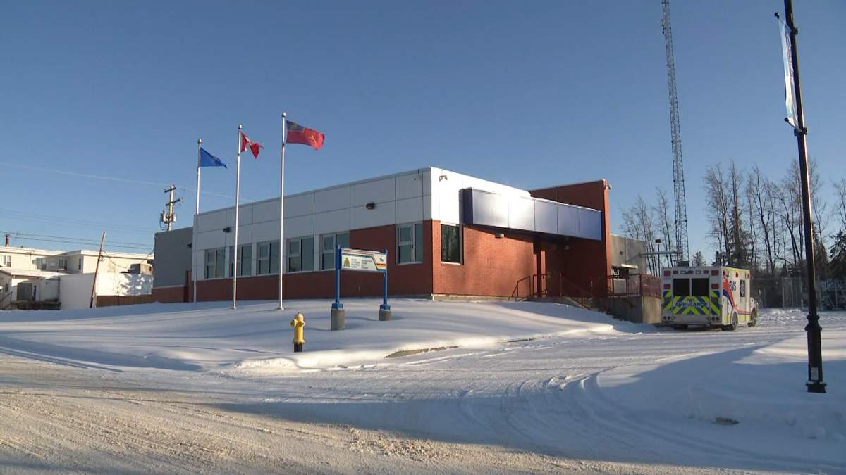 An ambulance is seen outside the RCMP in Evansburg on Sunday, after officers responded to the nearby community of Entwistle earlier in the day.