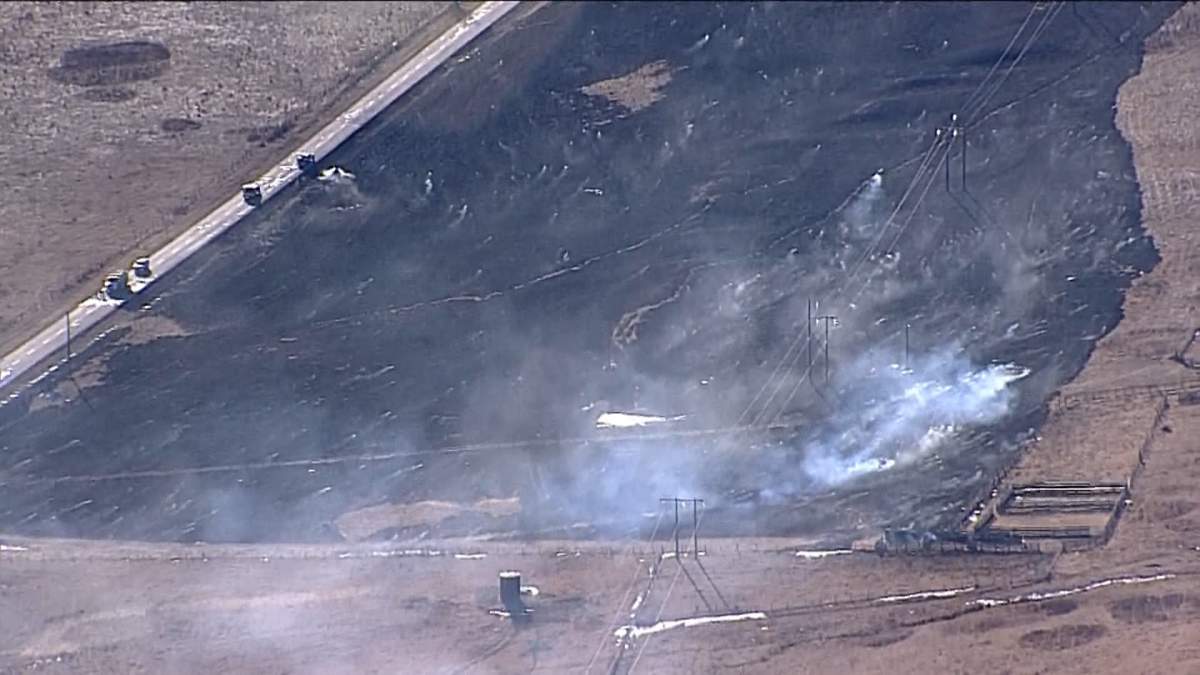 A grass fire that broke out west of Cochrane on Tuesday was initially reported to be spreading rapidly and there were concerns some evacuations could be needed if it continued to grow.